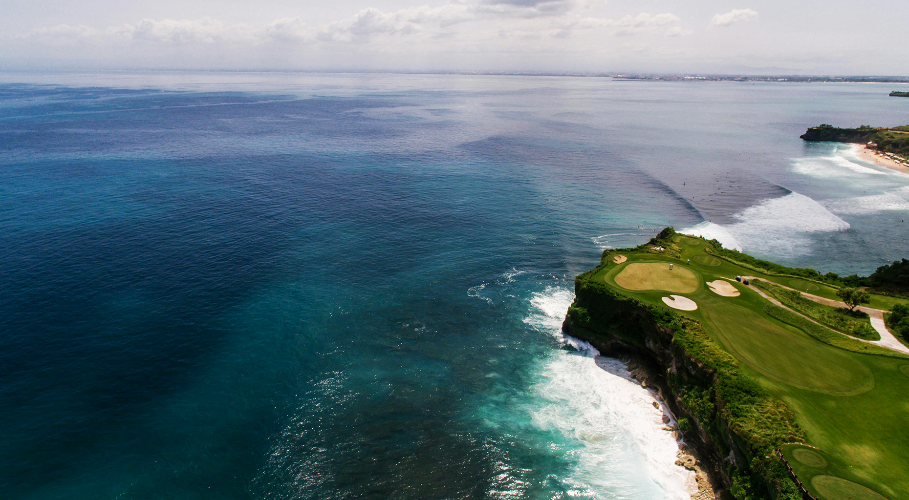 Aerial view of a golf course above the ocean