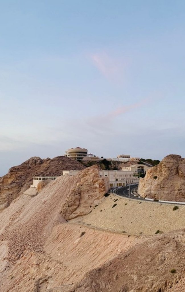 The summit of Jebel Hafeet above the desert at dusk