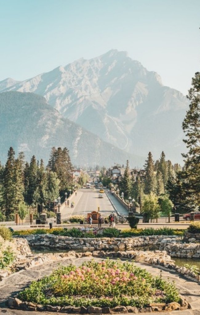 Cascade Mountain rising above gardens in the town of Banff