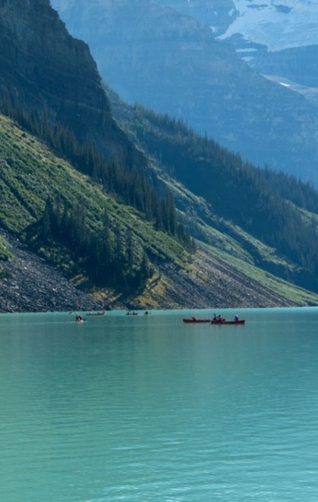 A canoe on the turquoise water of Lake Louise