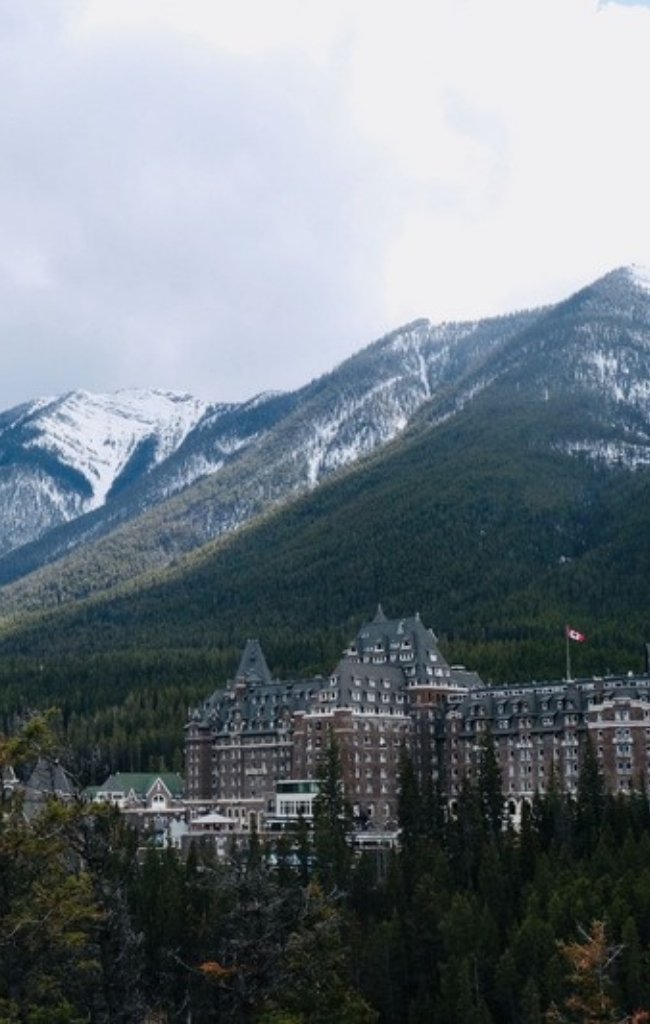 The historic Banff Springs hotel below snowy mountains
