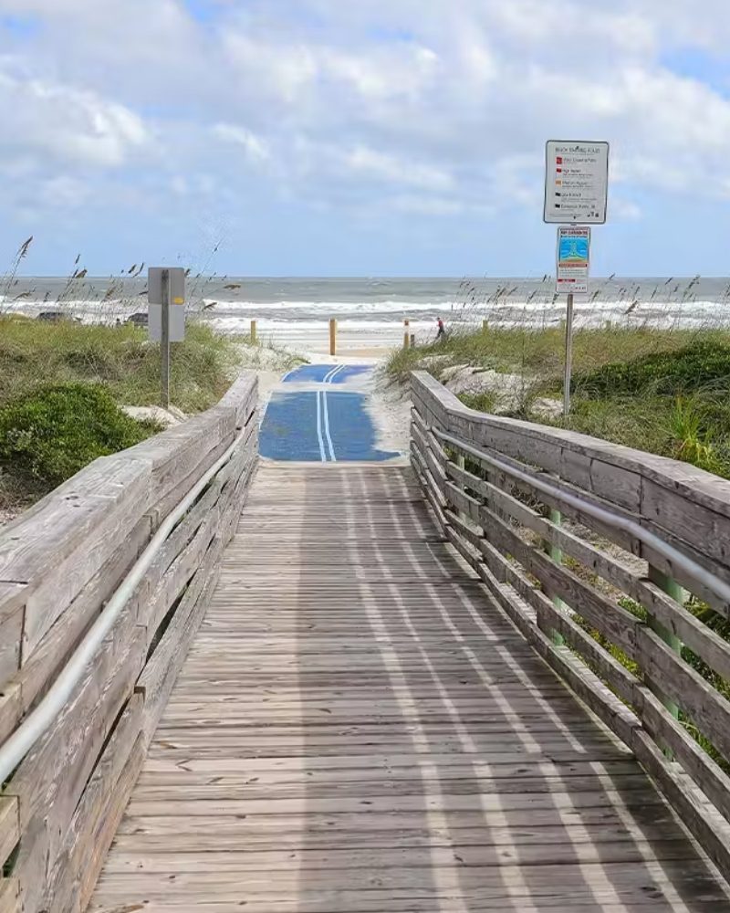 A wooden boardwalk leading to a beach on the Southeast coast
