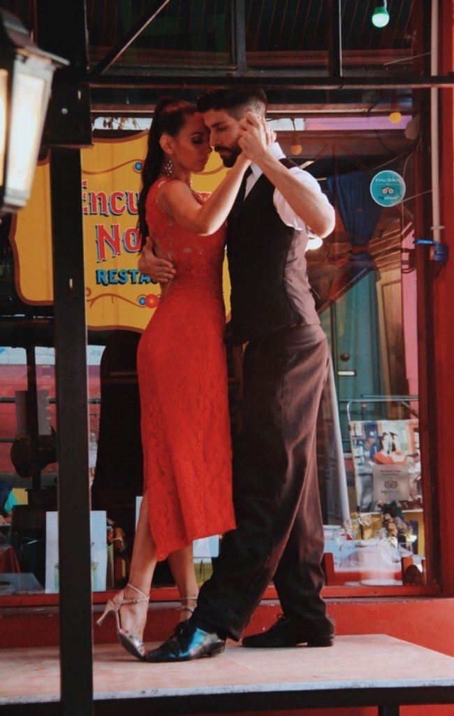 A couple dancing tango on a street in Buenos Aires