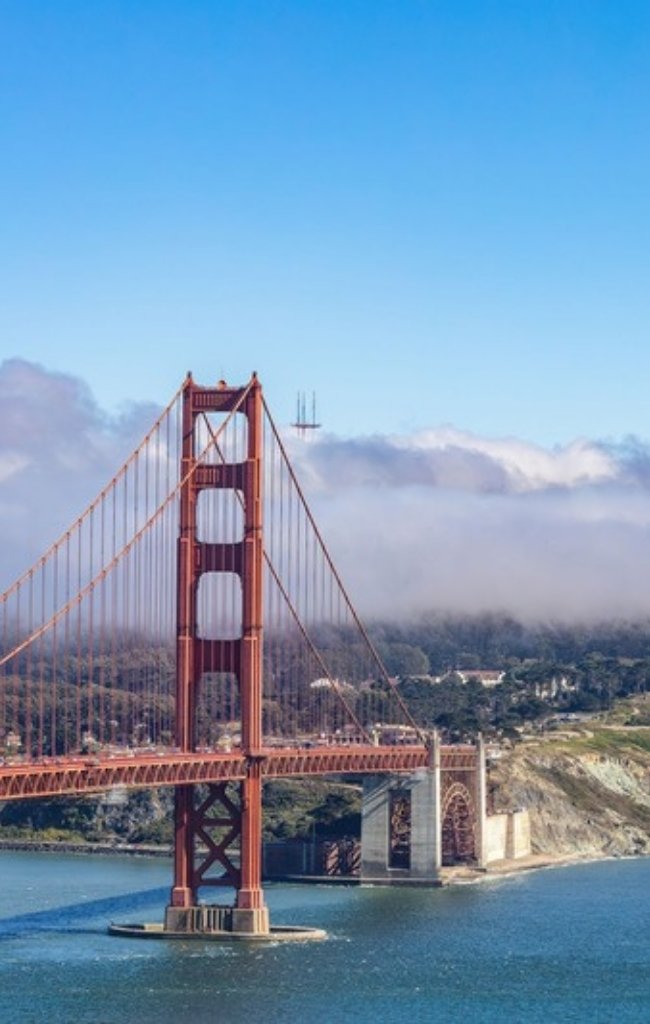 The Golden Gate Bridge with fog over the Marin Headlands
