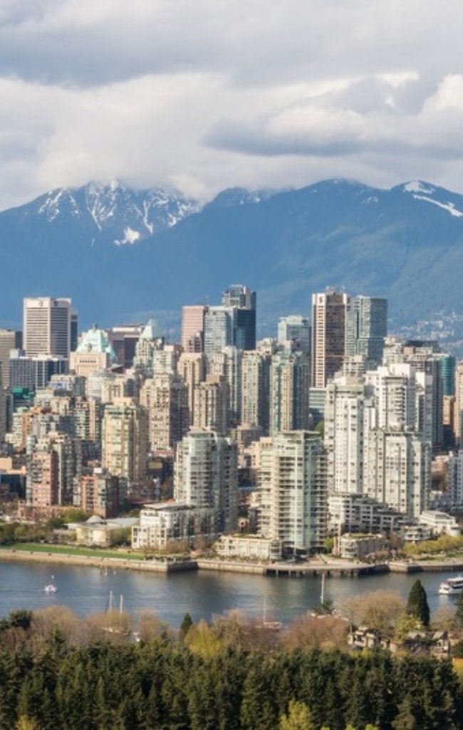 The Vancouver skyline and marina below the mountains