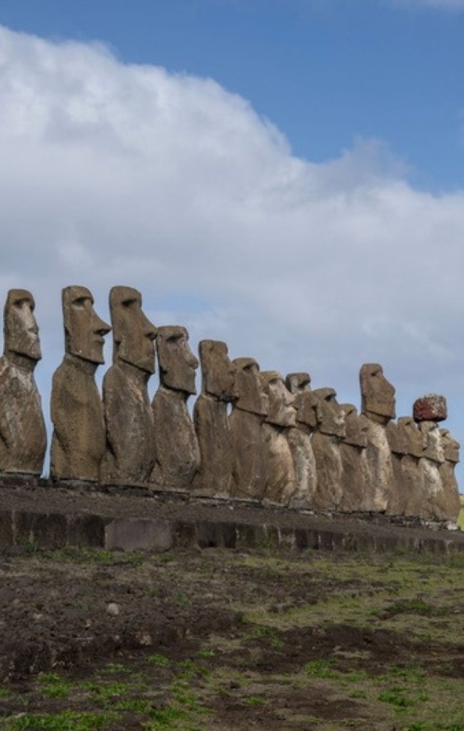 A row of moai statues on a stone platform on Easter Island