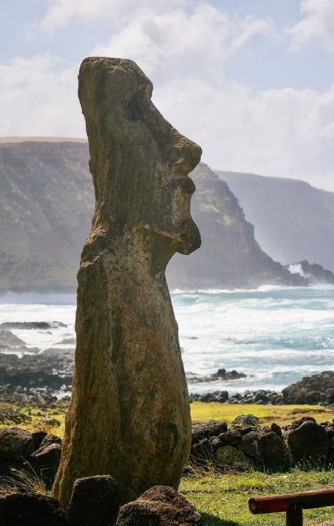A moai statue above the sea on Easter Island