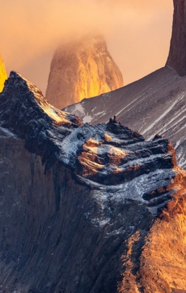 The peaks of Torres del Paine glowing at sunrise