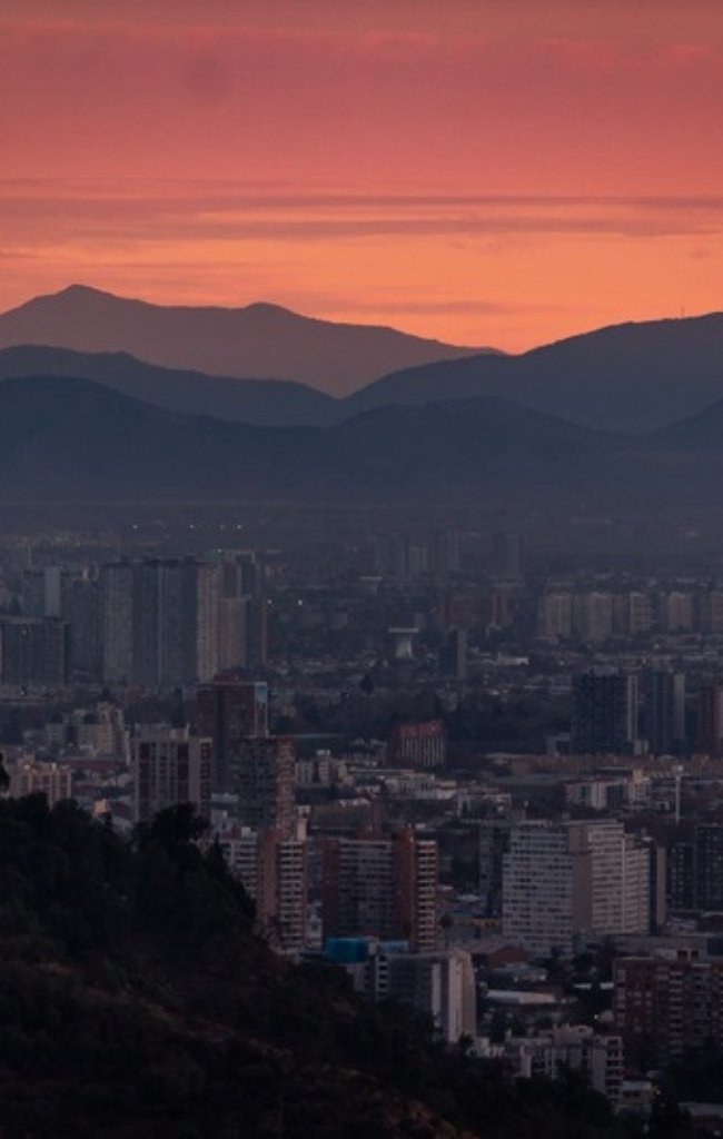 Santiago at dusk below the Andes