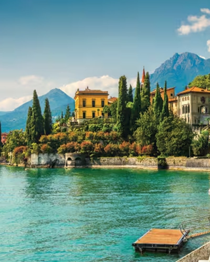 Villas and cypress trees along the shore of Lake Como