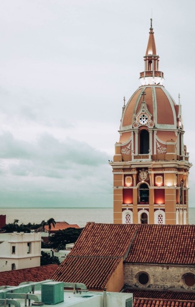 The cathedral tower rising above the rooftops of Cartagena