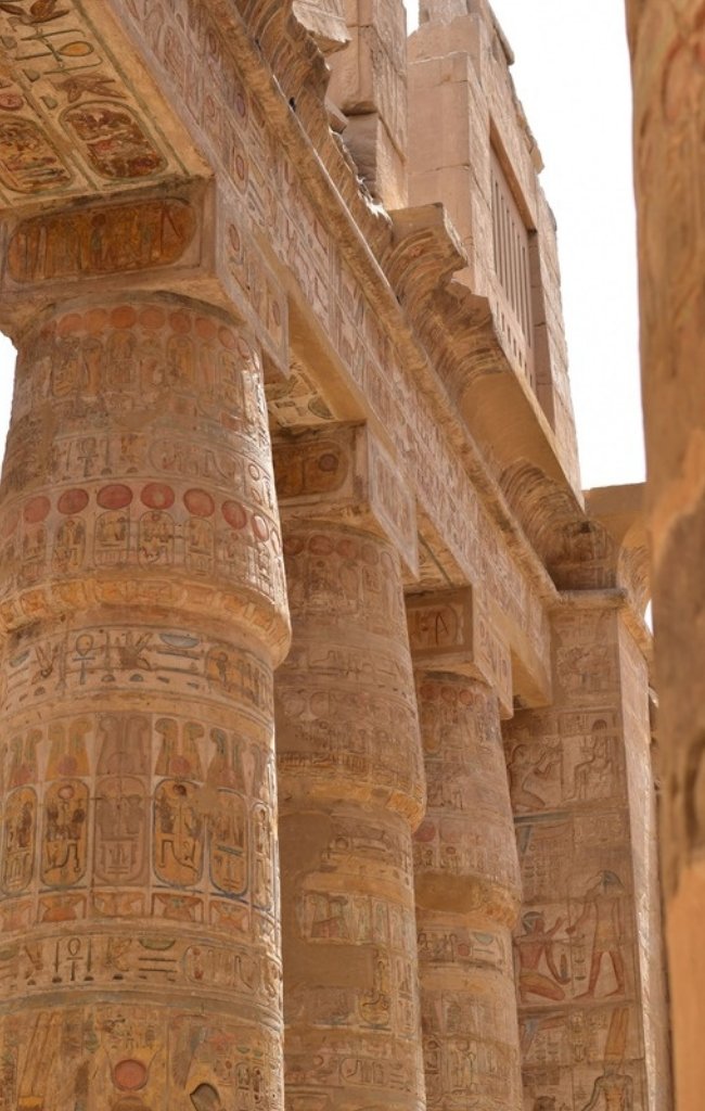 Carved hieroglyphs on the columns of Karnak Temple