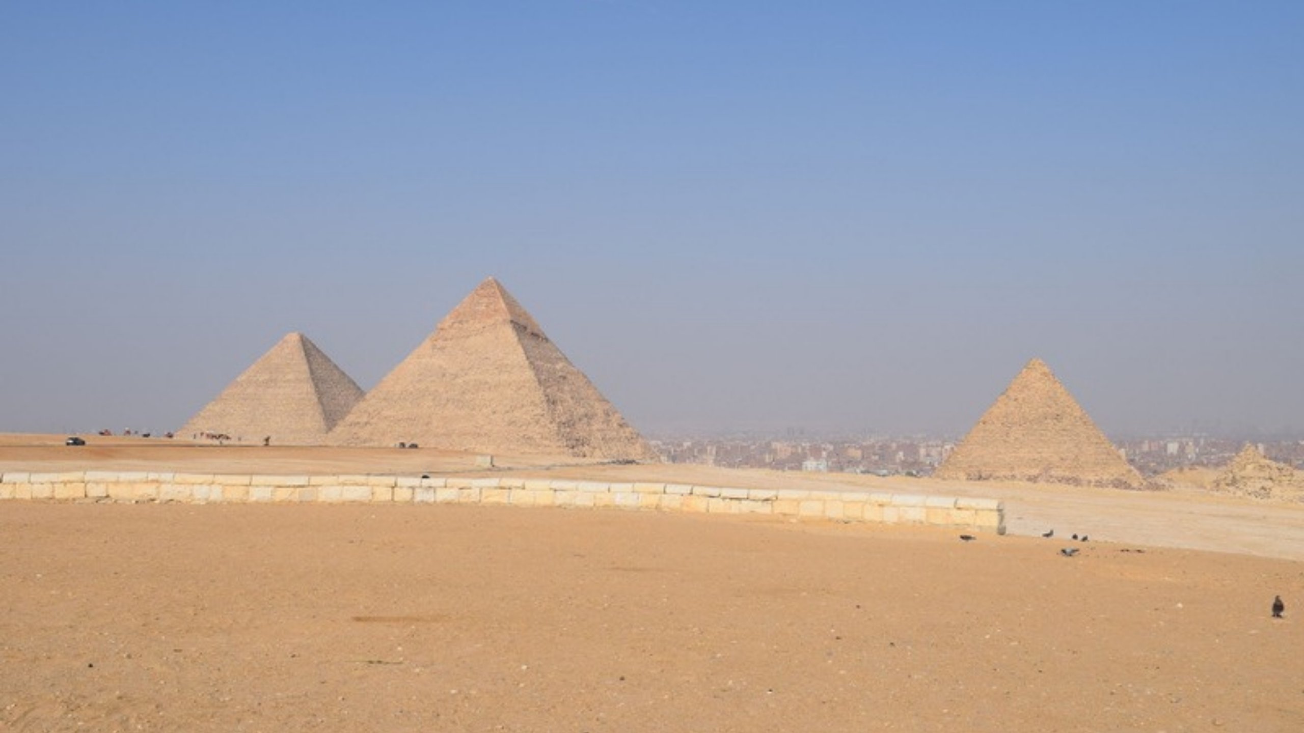 The pyramids of Giza under a clear blue sky