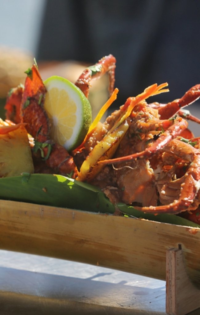 Grilled lobster served on a bamboo platter