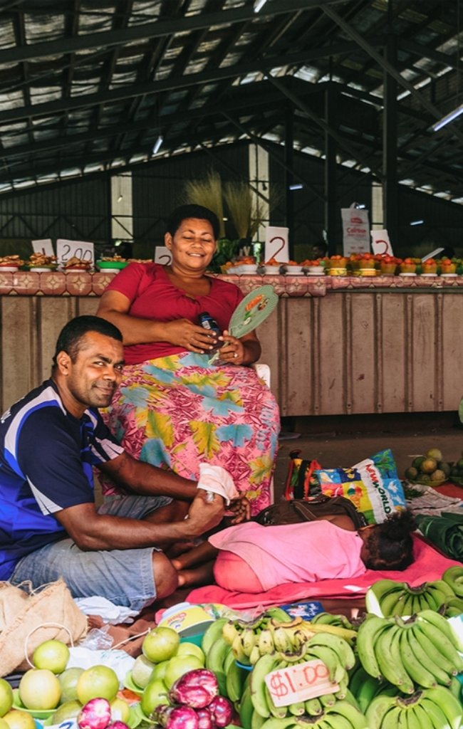 Vendors with fresh fruit at a market in Nadi