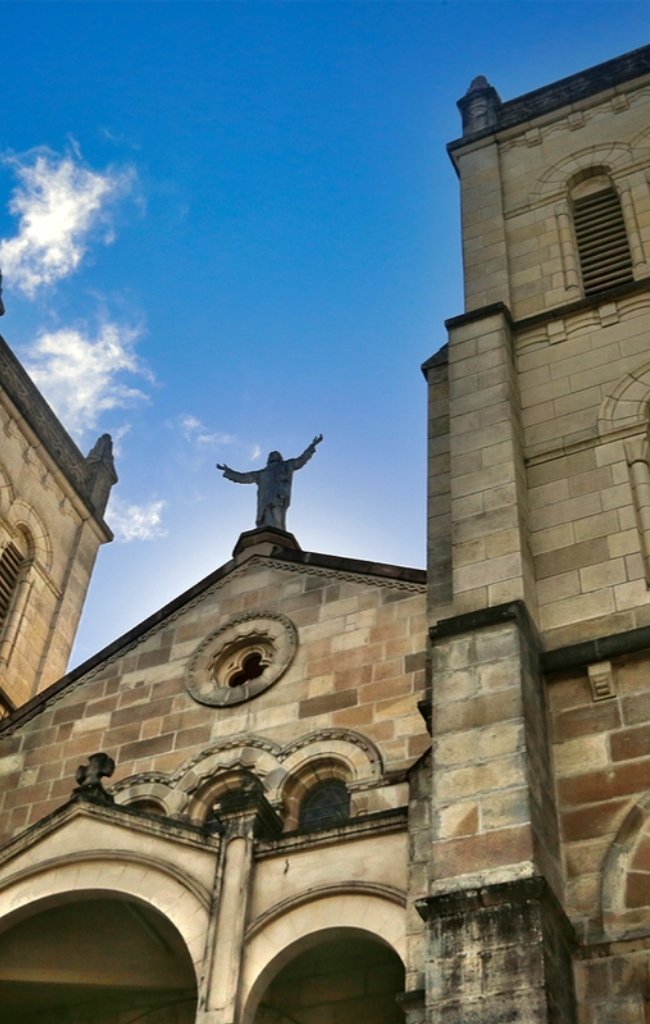 The stone towers of Sacred Heart Cathedral in Suva