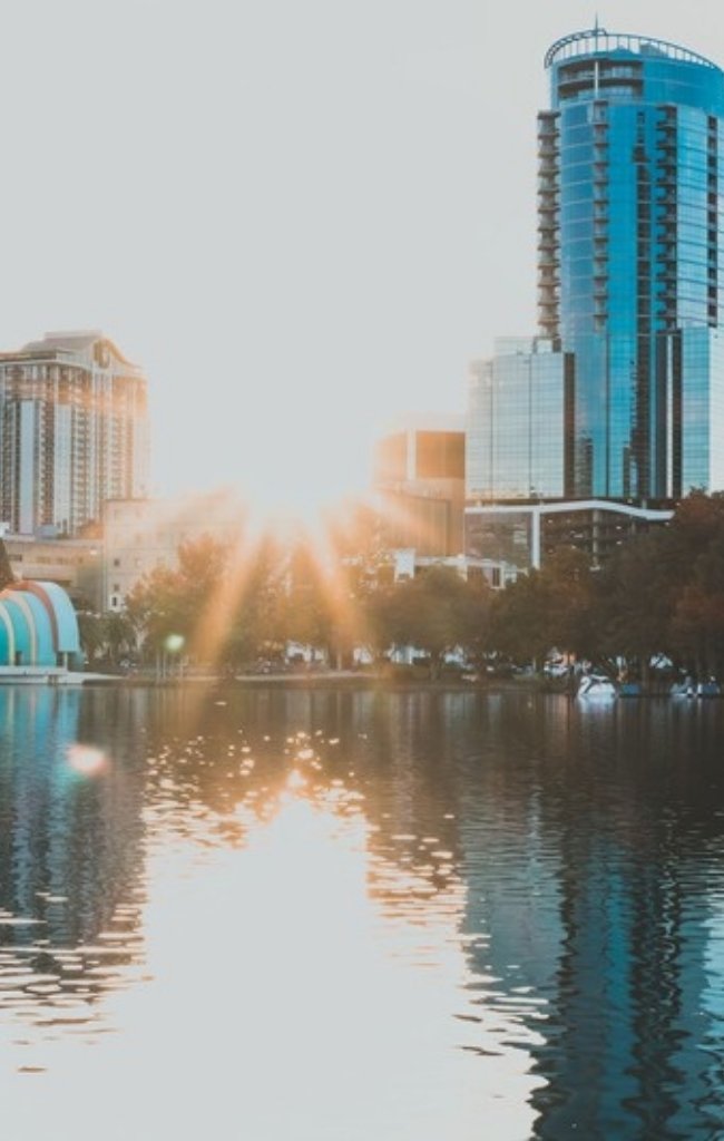 The Orlando skyline reflected in Lake Eola at sunrise