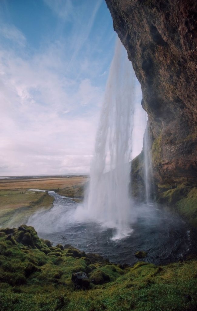 Seljalandsfoss waterfall cascading over green cliffs