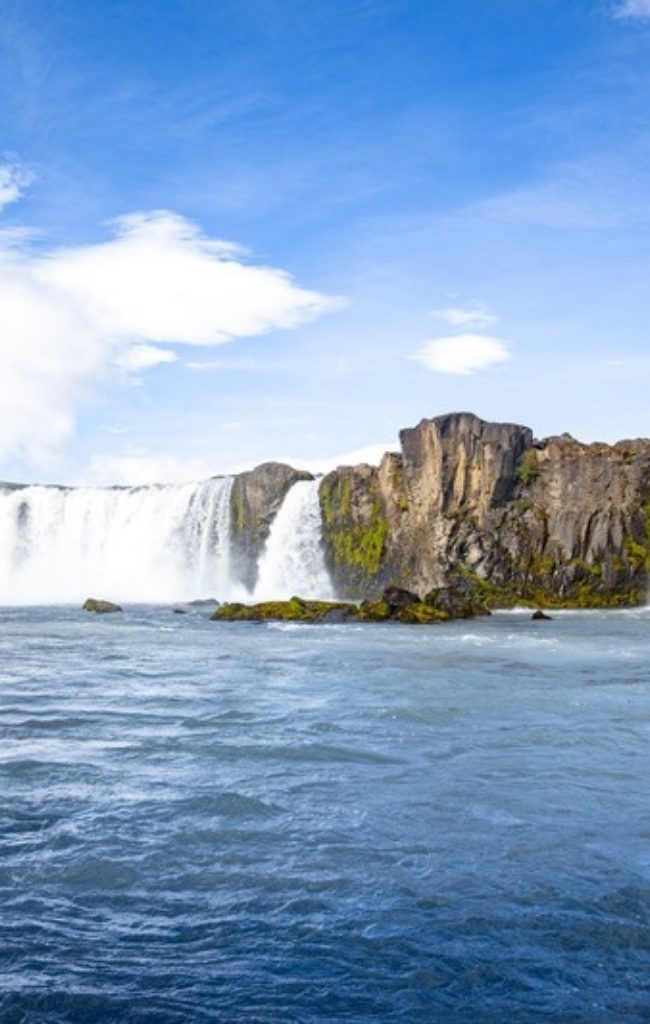 Godafoss waterfall in North Iceland under a blue sky