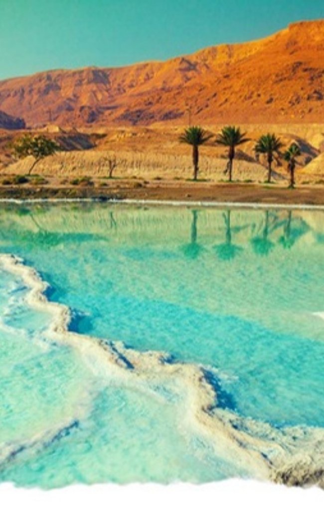 White salt formations along the turquoise shore of the Dead Sea
