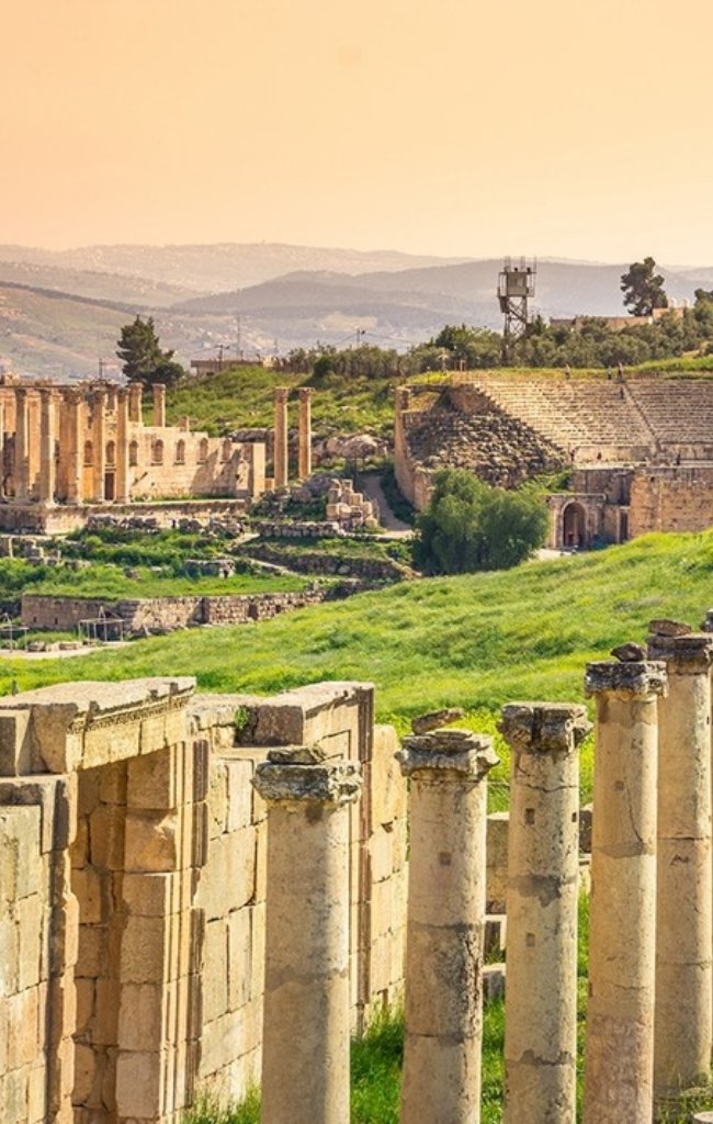 Roman columns and a hippodrome among green hills at Jerash