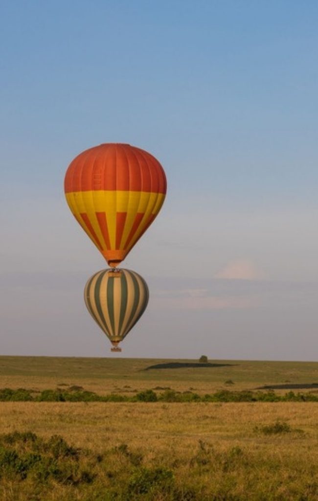 Hot air balloons over the Maasai Mara at sunrise