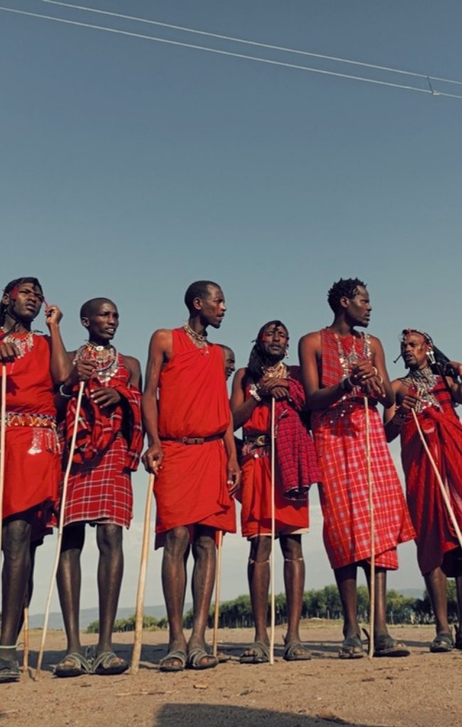 Maasai men in traditional dress on the Kenyan savannah