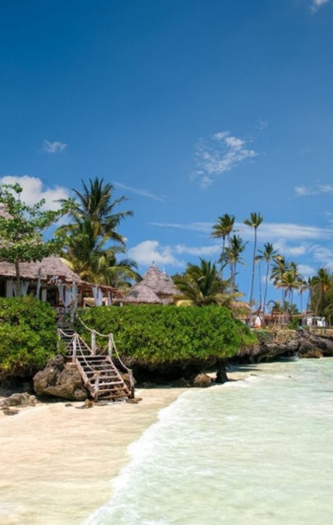 Palm trees and turquoise water on a Zanzibar beach