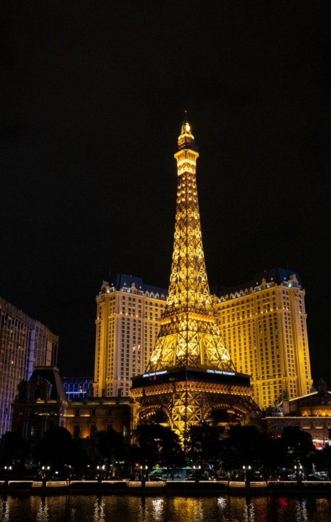 The Eiffel Tower replica at Paris Las Vegas lit up at night