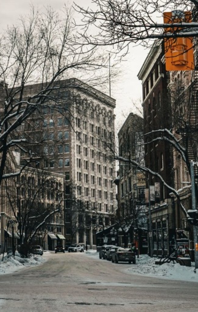 A snowy Winnipeg street lined with historic buildings