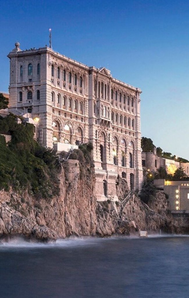The Oceanographic Museum on a cliff above the sea at dusk
