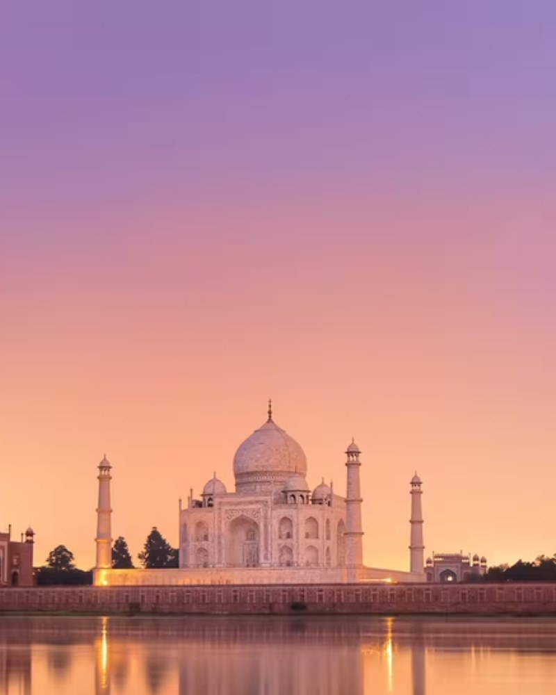 The Taj Mahal at sunset across the Yamuna River