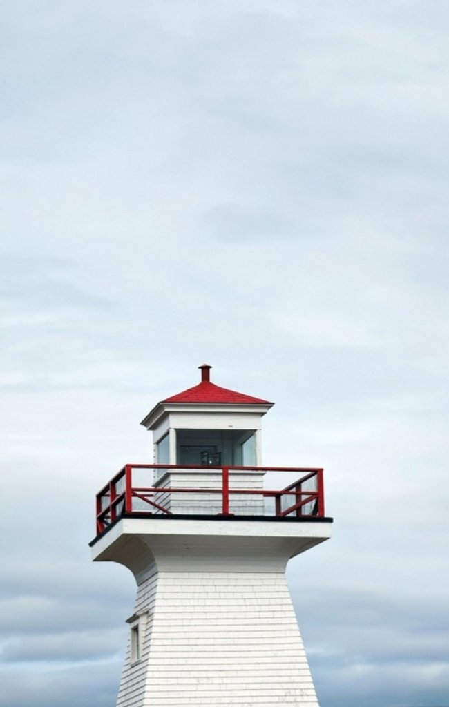 The red and white lighthouse at Five Islands on the Bay of Fundy
