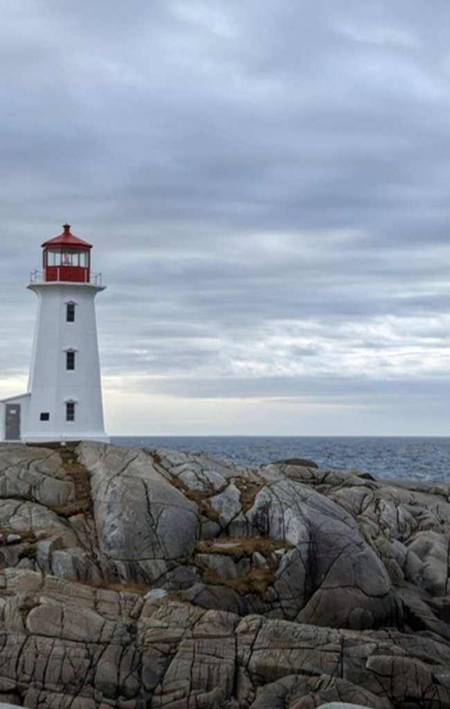 The lighthouse on the granite shore at Peggys Cove