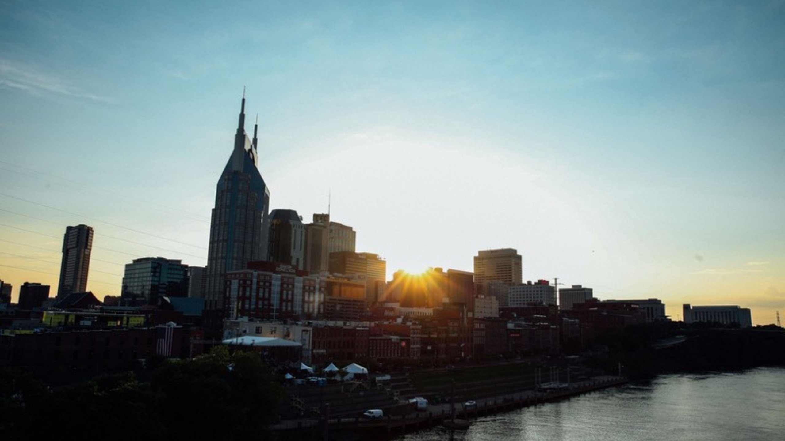 The Nashville skyline above the Cumberland River at sunset