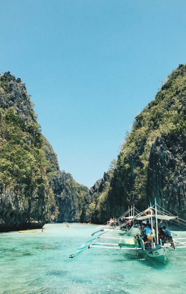 A turquoise lagoon framed by limestone cliffs in El Nido