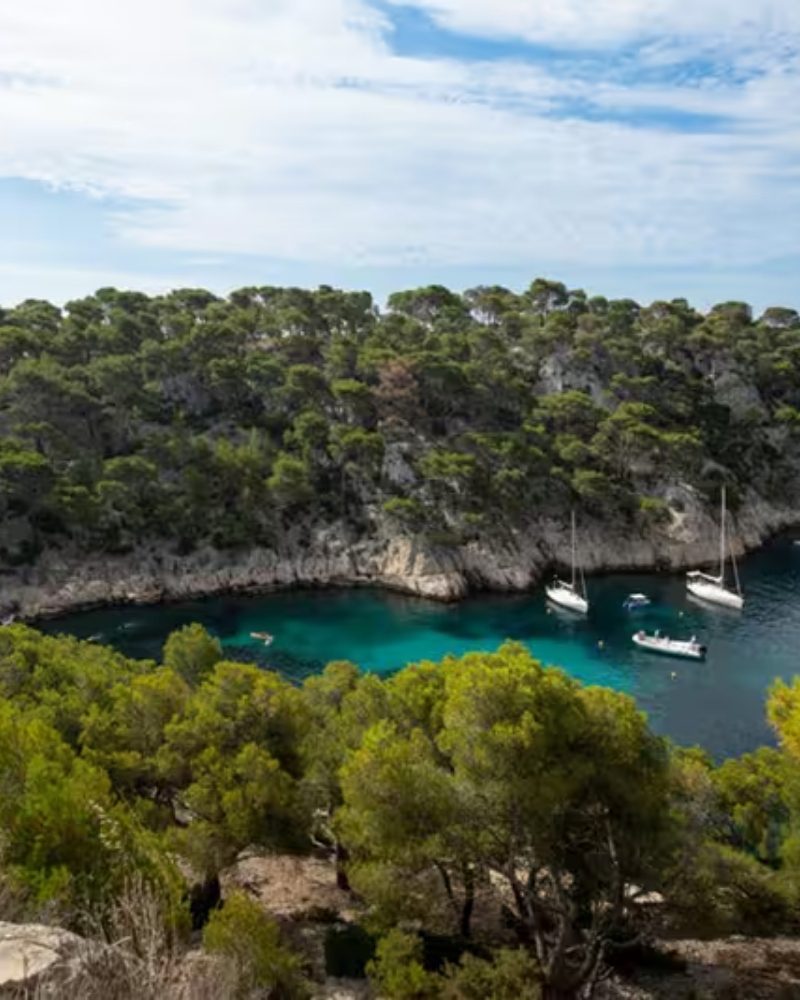 Sailboats in a turquoise calanque near Cassis, France