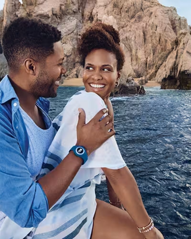 A couple on a boat near the sea cliffs of Cabo San Lucas