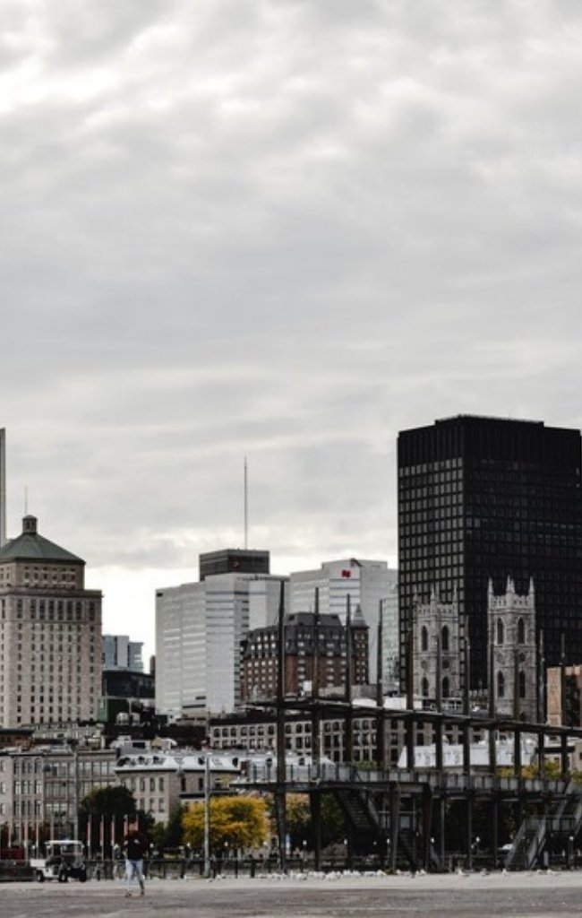 The downtown Montreal skyline under a cloudy sky