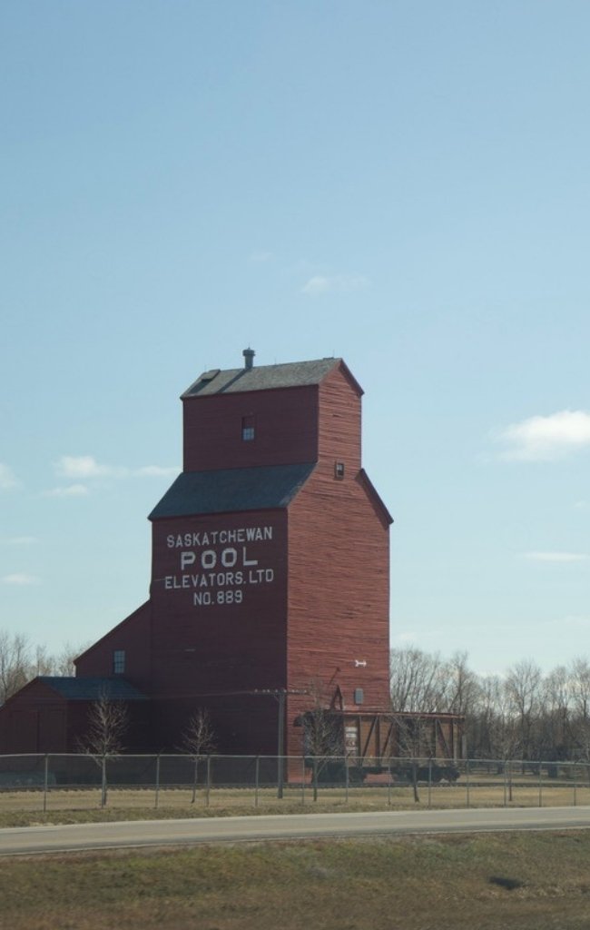 A red grain elevator in the Saskatchewan countryside