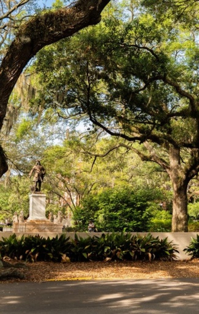 Live oaks shading a monument in one of Savannah's historic squares