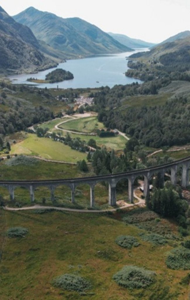 The Glenfinnan Viaduct curving through the Highlands