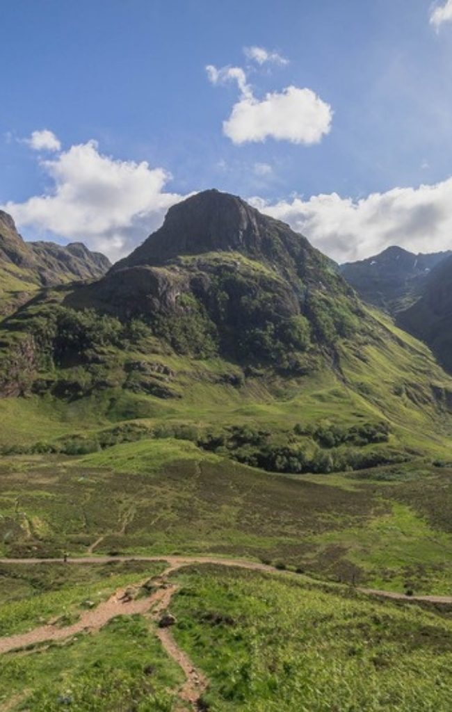 The Three Sisters of Glen Coe under a summer sky