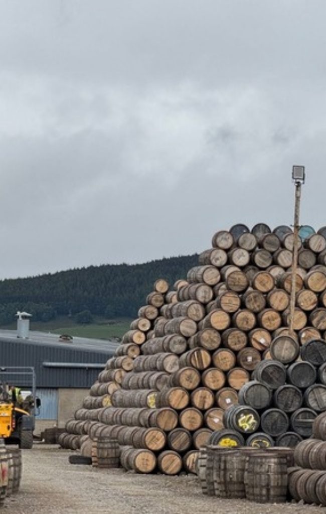 Stacked whisky casks at a distillery in Dufftown, Speyside