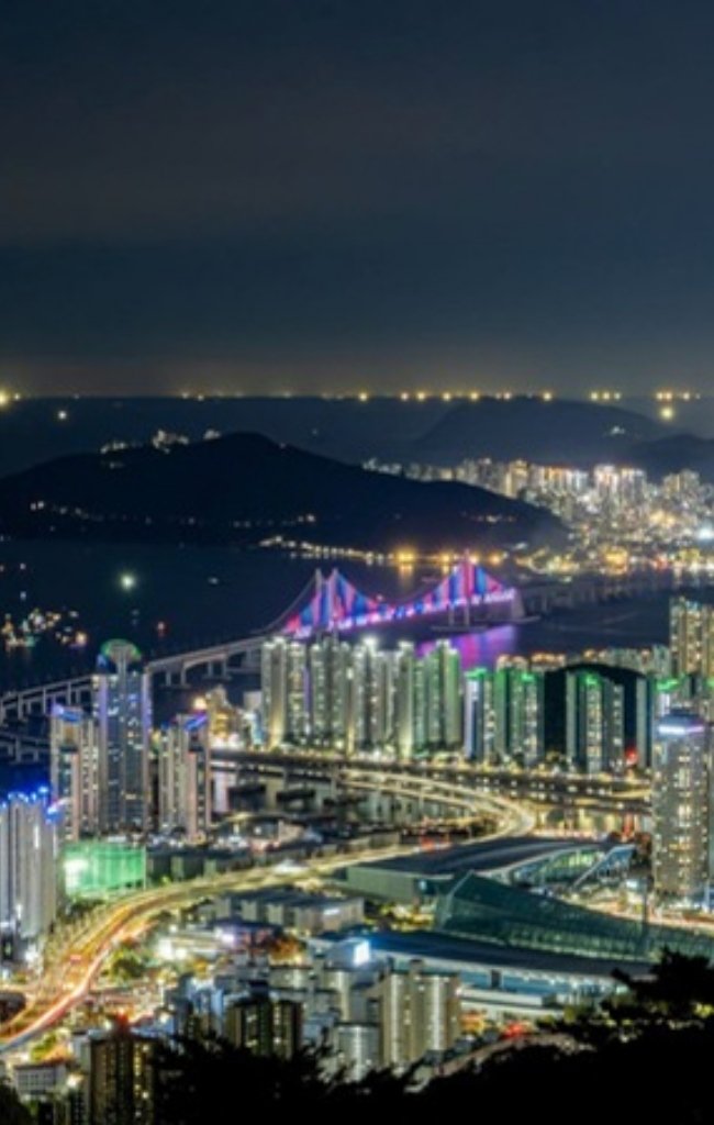 Gwangan Bridge and the Busan skyline lit up at night