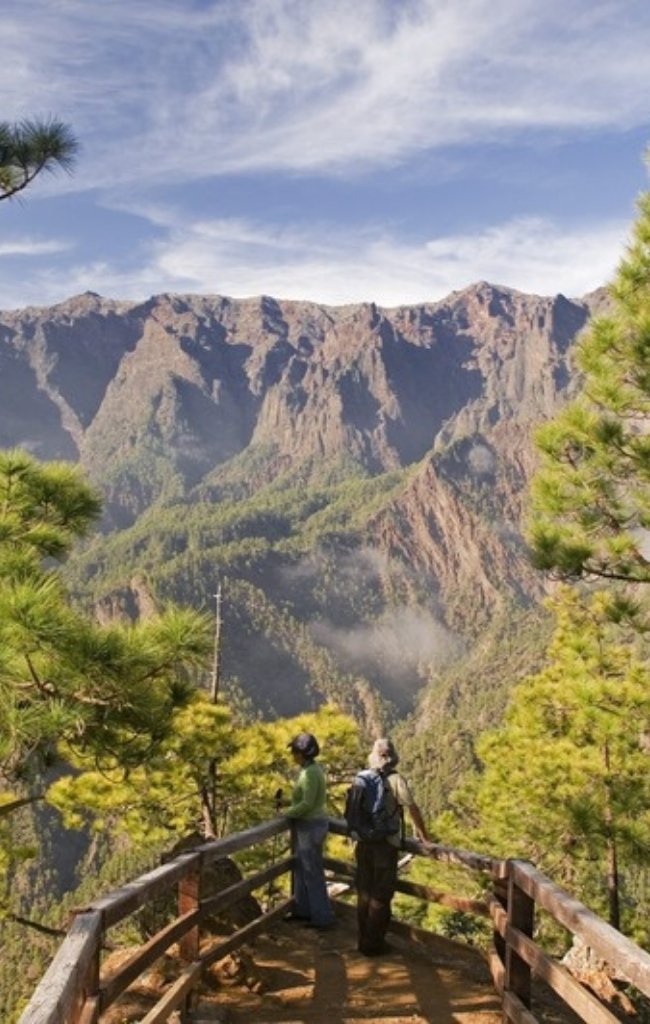 Hikers at a viewpoint over the Caldera de Taburiente on La Palma