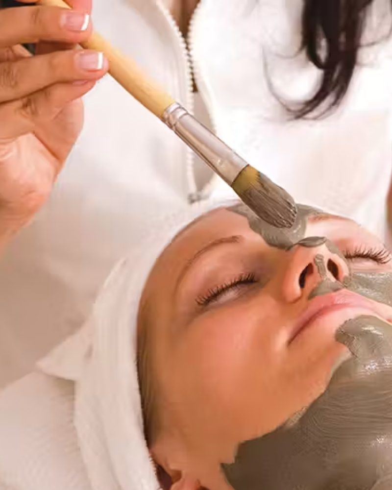 A guest receiving a facial at the spa