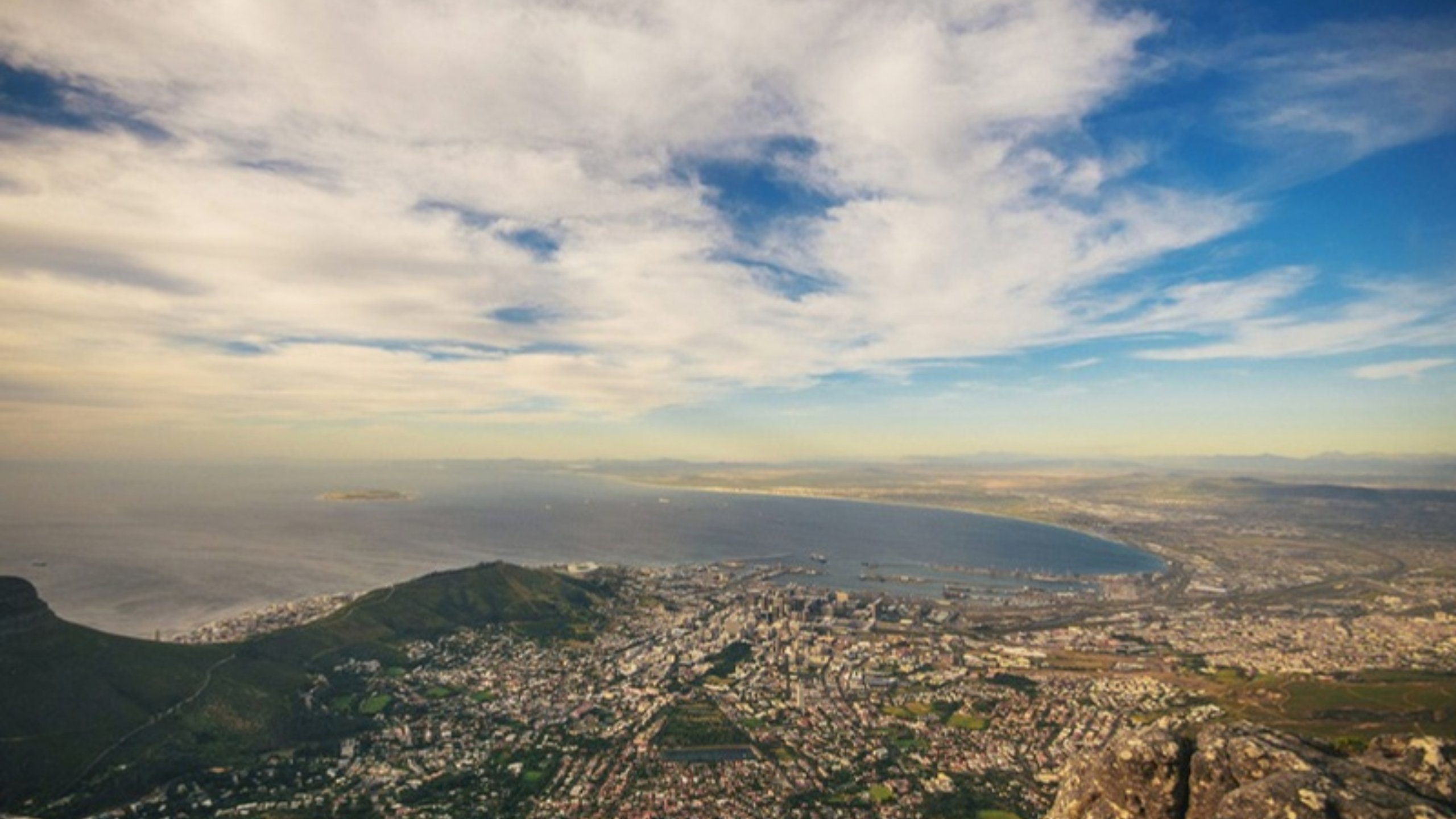 Cape Town and Table Bay seen from Table Mountain under dramatic clouds