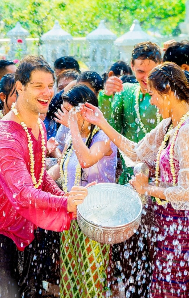 Travelers celebrating the Songkran water festival