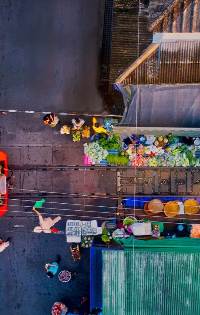 Aerial view of a street market with fruit stalls in Thailand